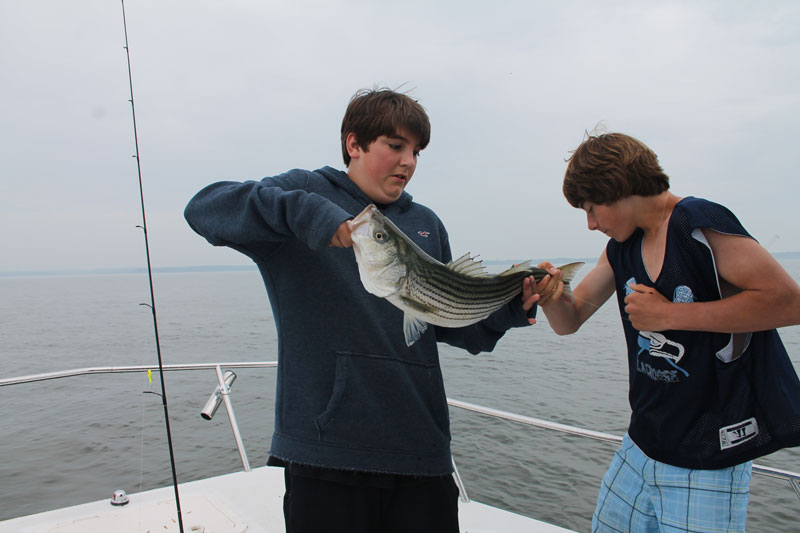 kids fishing for stripers