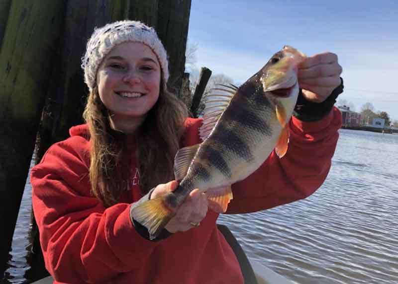 mollie rudow holds up a huge perch