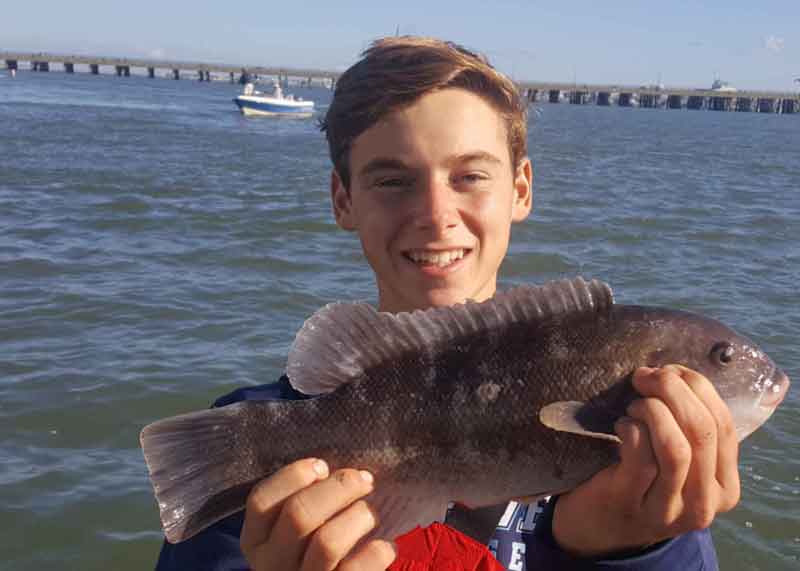 tautog fisherman with a catch