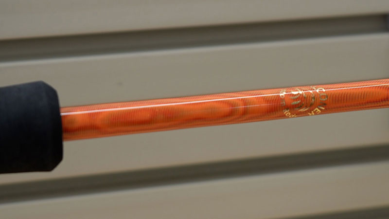 a custom fishing rod with tiger wraps