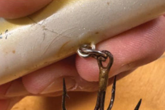 removing a treble hook from a fishing lure