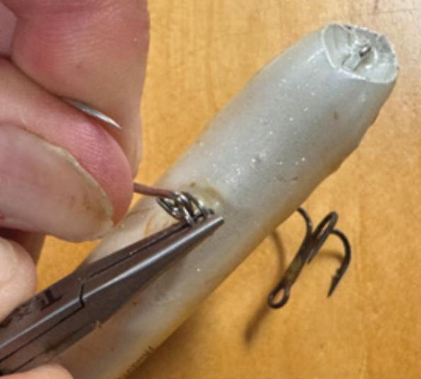 putting a single hook on the fishing lure in place of the treble