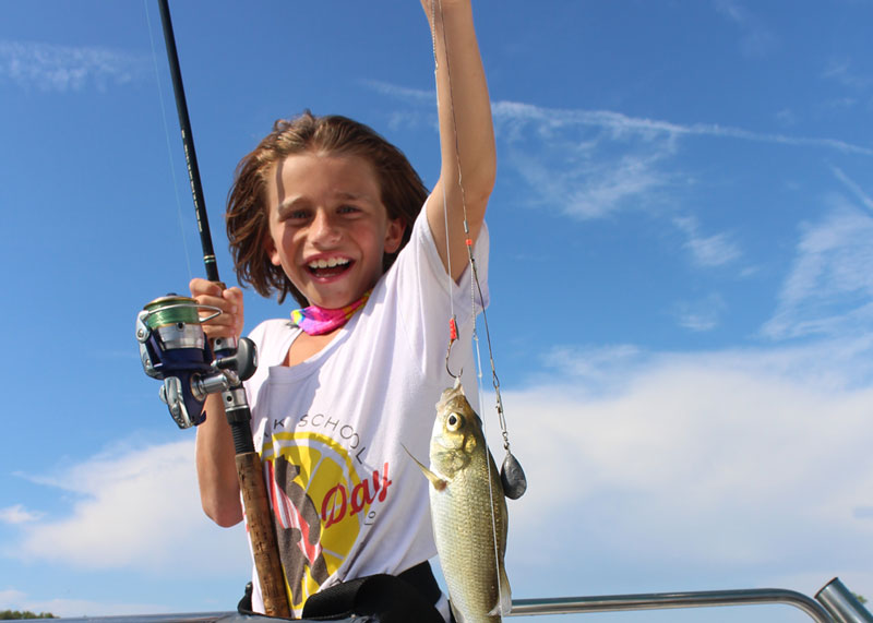 young angler with white perch