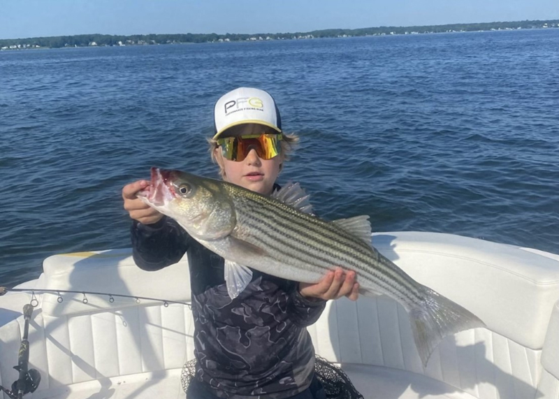striper angler with a fish