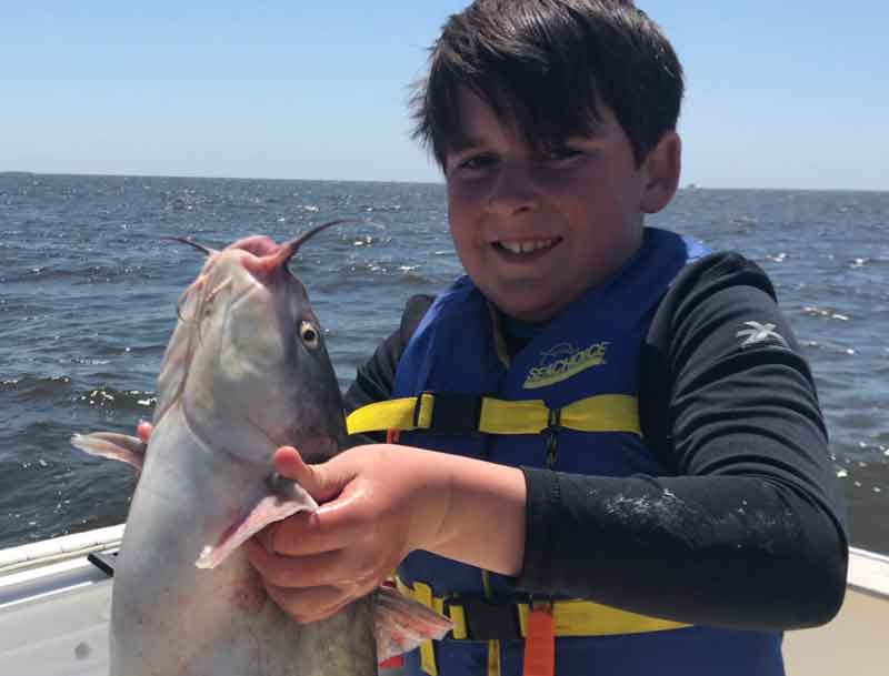 boy with a big catfish