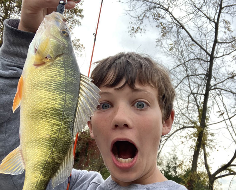 angler with a surprise yellow perch